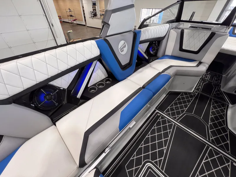 Slide: The Image of Interior of 2021 Tigé 25ZX with blue and white seating. - 15