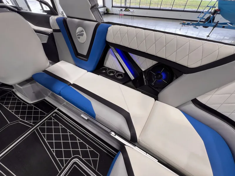 Slide: The Image of Interior of 2021 Tigé 25ZX with blue and white seating. - 16