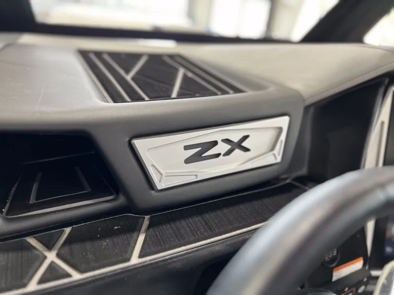 Slide: The Image of Close-up of a 2021 Tigé 25ZX boat dashboard. - 22