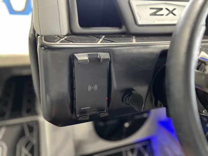 Slide: The Image of Dashboard of 2021 Tigé 25ZX with charging dock. - 23