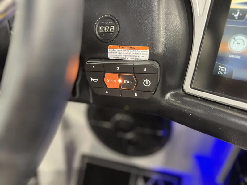 Slide: The Image of Dashboard of 2021 Tigé 25ZX with start-stop button. - 24