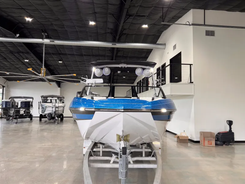Slide: The Image of 2021 Tigé 25ZX boat in a showroom. - 7