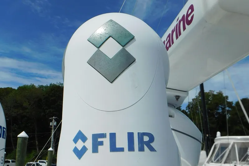 Slide: The Image of FLIR camera on 2013 Sea Ray 510 Sundancer yacht, docked with clear sky background. - 14
