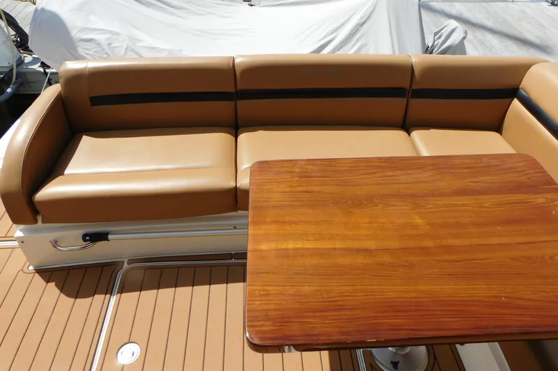 Slide: The Image of Luxurious seating and wooden table on 2013 Sea Ray 510 Sundancer yacht. - 22