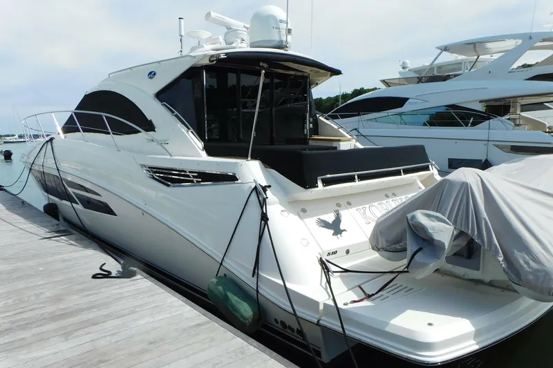 Slide: The Image of 2013 Sea Ray 510 Sundancer yacht docked at marina, rear view. - 6