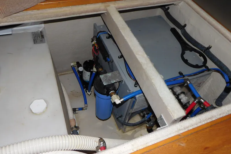 Slide: The Image of Engine compartment of 2013 Sea Ray 510 Sundancer with visible water filtration system. - 65