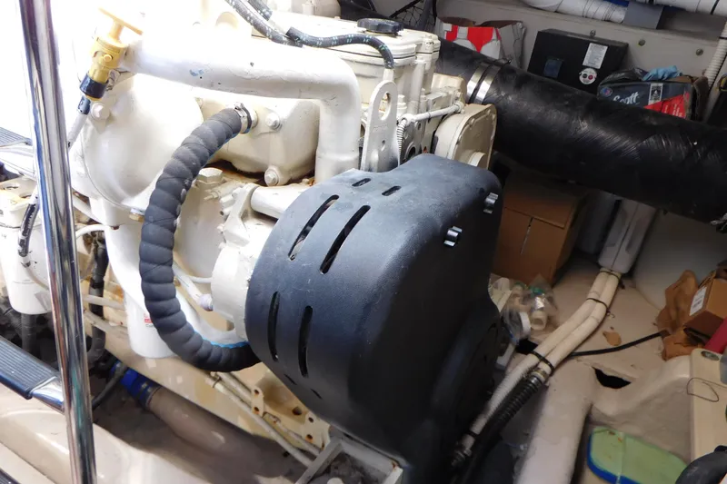 Slide: The Image of Engine compartment of a 2013 Sea Ray 510 Sundancer boat, showcasing mechanical components. - 80