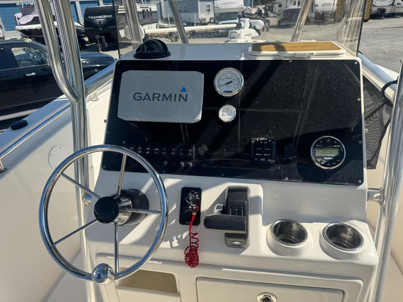 Slide: The Image of 2024 Bulls Bay 230 Center Console dashboard with Garmin navigation system. - 11