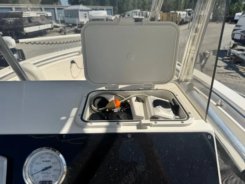 Slide: The Image of 2024 Bulls Bay 230 Center Console with open storage compartment. - 13