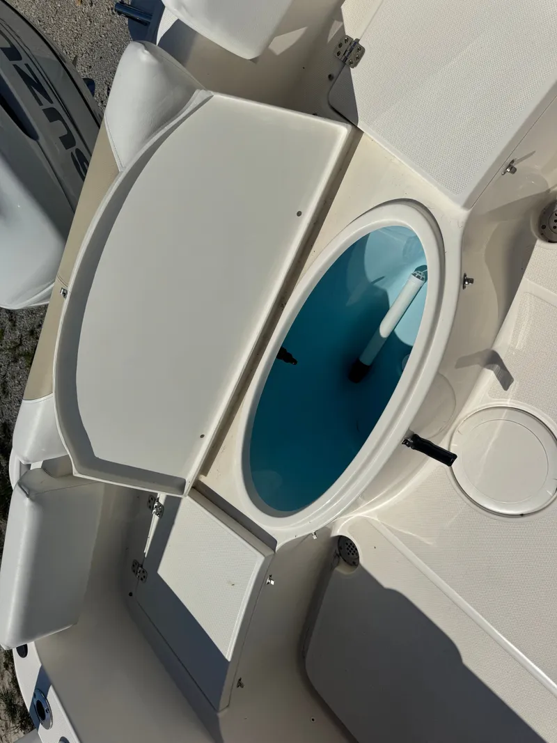 Slide: The Image of 2024 Bulls Bay 230 Center Console boat with open storage compartment. - 16