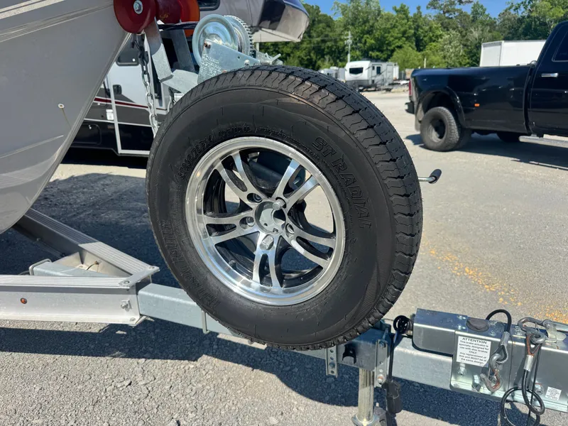 Slide: The Image of Trailer tire of a 2024 Bulls Bay 230 Center Console boat. - 18