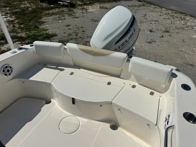 Slide: The Image of 2024 Bulls Bay 230 Center Console boat rear view with Suzuki engine. - 7