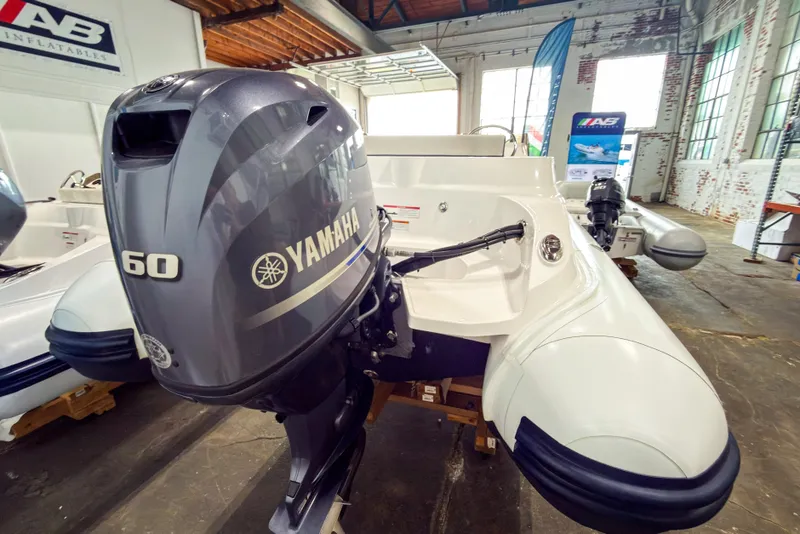 Slide: The Image of 2023 AB Inflatables Nautilus 13 with Yamaha 60 outboard motor in showroom. - 23