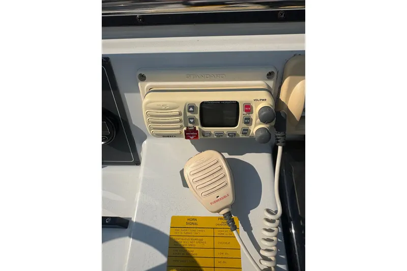 Slide: The Image of 1993 Boston Whaler 21 Outrage boat radio and control panel close-up. - 12