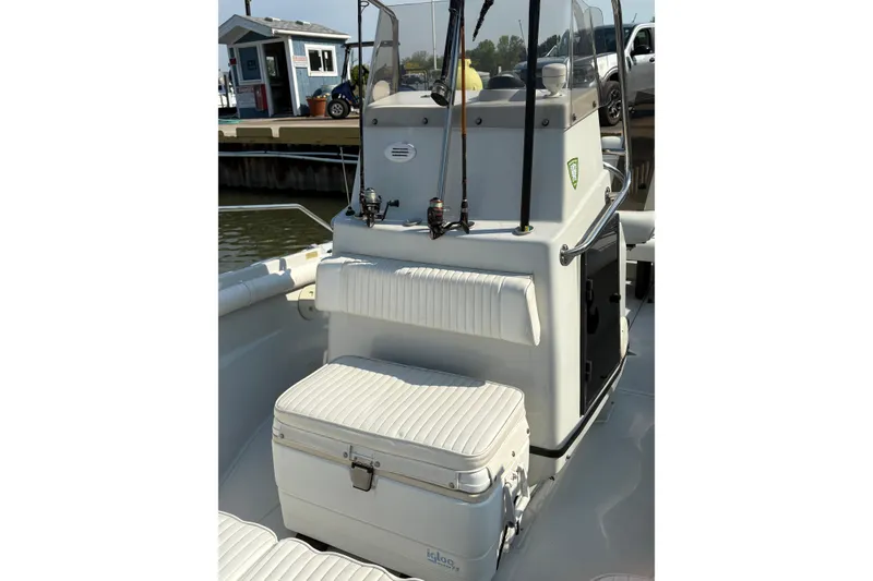 Slide: The Image of 1993 Boston Whaler 21 Outrage boat interior with seating and cooler. - 3
