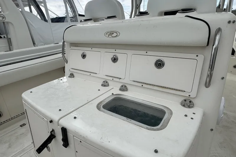 Slide: The Image of 2007 Robalo R300 Center Console boat with storage compartments and livewell. - 4