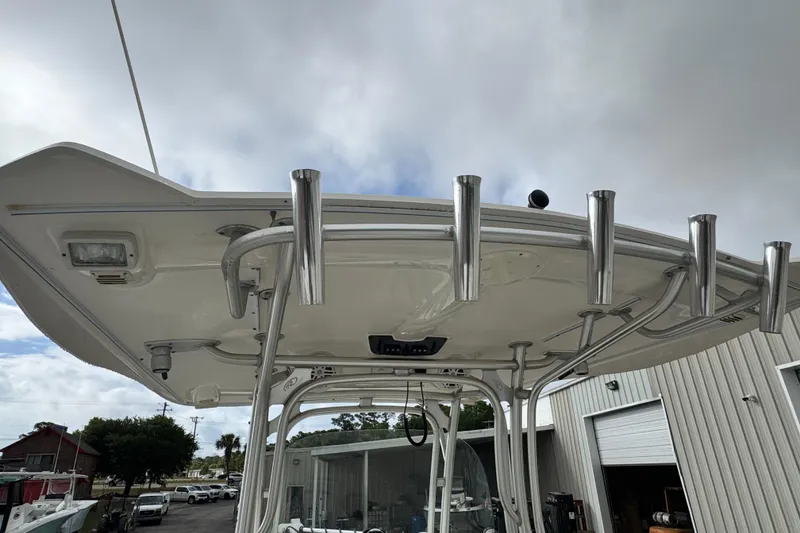 Slide: The Image of 2007 Robalo R300 Center Console boat with rod holders and T-top. - 5