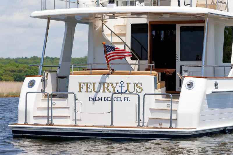 Slide: The Image of Grand Banks 59 Aleutian RP yacht, 2007, docked with American flag, Palm Beach, FL. - 10