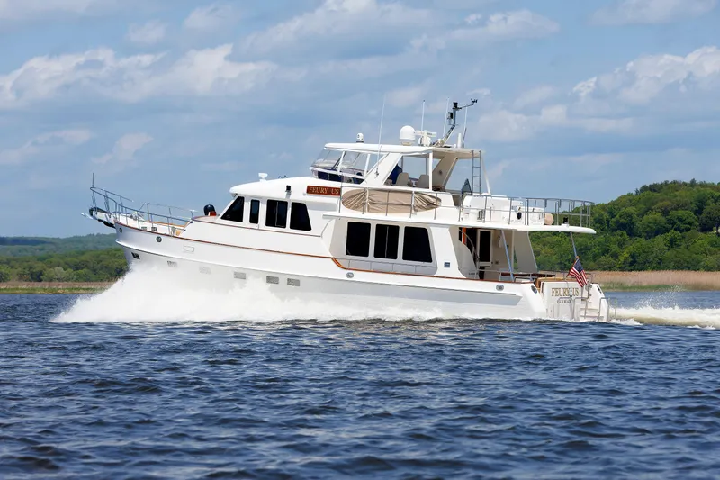 Slide: The Image of 2007 Grand Banks 59 Aleutian RP yacht cruising on a sunny day. - 104