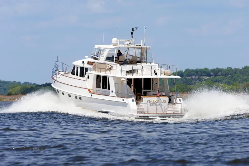 Slide: The Image of 2007 Grand Banks 59 Aleutian RP yacht cruising on open water. - 105