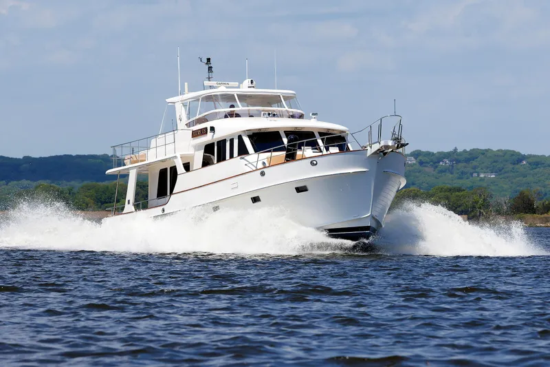 Slide: The Image of 2007 Grand Banks 59 Aleutian RP yacht cruising on open water. - 107
