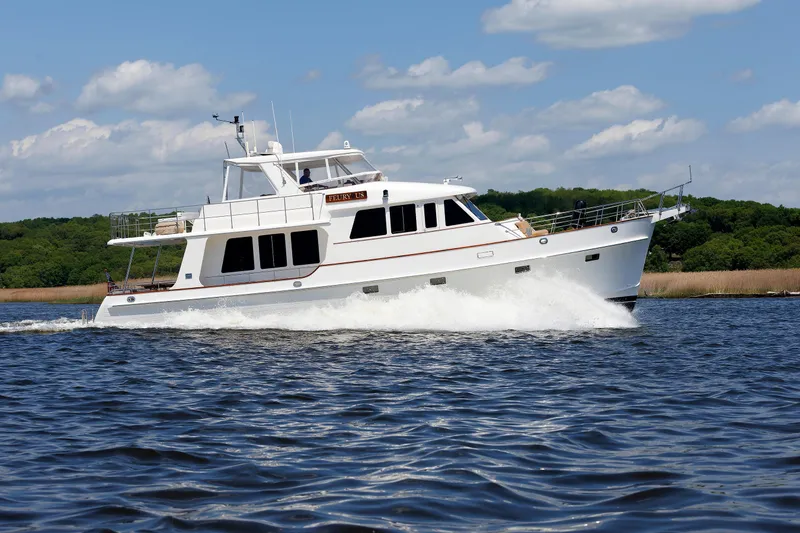 Slide: The Image of 2007 Grand Banks 59 Aleutian RP yacht cruising on a sunny day. - 108