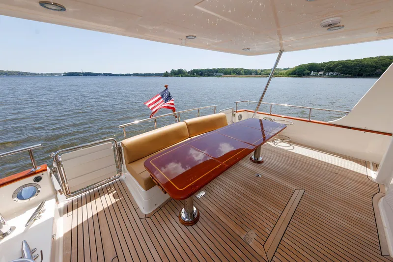 Slide: The Image of Luxurious 2007 Grand Banks 59 Aleutian RP yacht deck with elegant seating and scenic water view. - 12