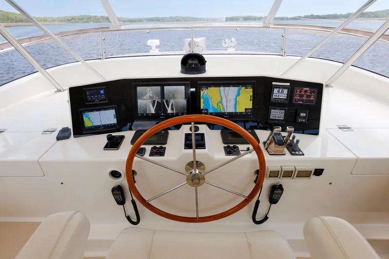 Slide: The Image of Helm of 2007 Grand Banks 59 Aleutian RP yacht with navigation equipment and steering wheel. - 19