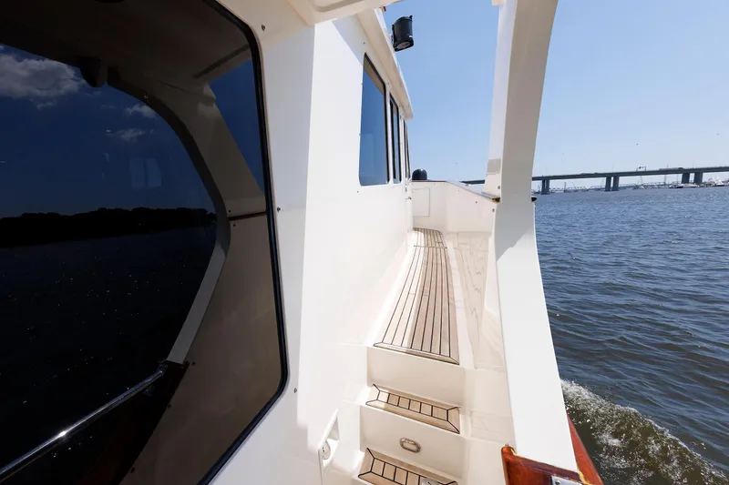 Slide: The Image of Side deck view of 2007 Grand Banks 59 Aleutian RP yacht on open water. - 21