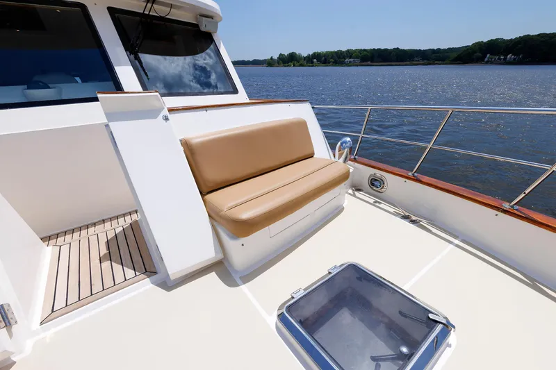 Slide: The Image of 2007 Grand Banks 59 Aleutian RP yacht deck with seating, overlooking serene waters. - 27