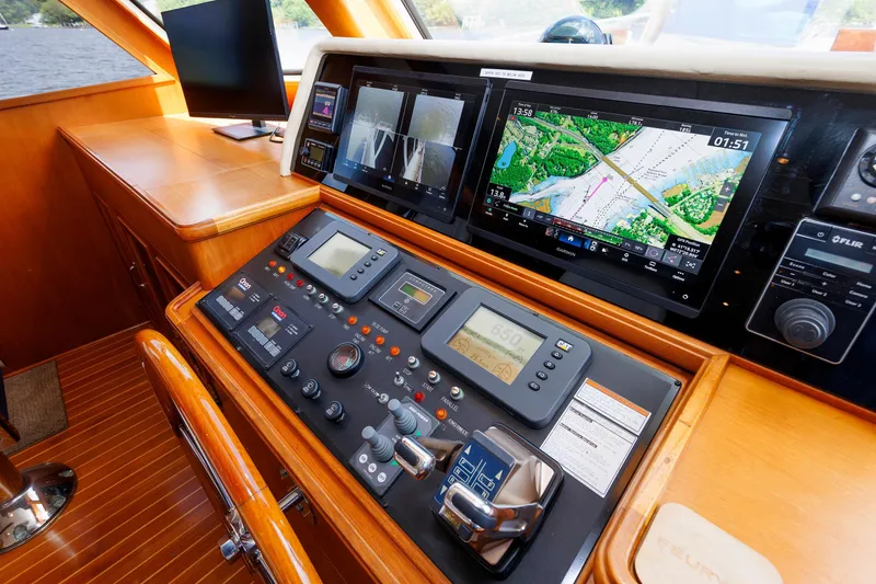 Slide: The Image of Control panel of 2007 Grand Banks 59 Aleutian RP yacht with navigation screens. - 3