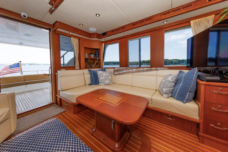 Slide: The Image of Luxurious interior of 2007 Grand Banks 59 Aleutian RP yacht with elegant seating and wooden accents. - 36