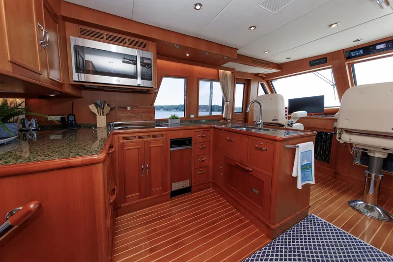 Slide: The Image of Luxurious 2007 Grand Banks 59 Aleutian RP yacht interior with elegant wood cabinetry and modern appliances. - 39