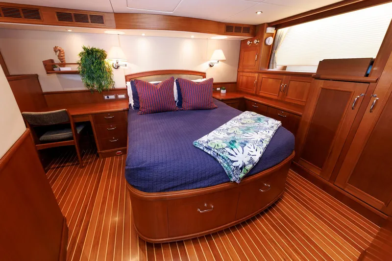 Slide: The Image of Luxurious 2007 Grand Banks 59 Aleutian RP yacht cabin with elegant wood finish and cozy bedding. - 4