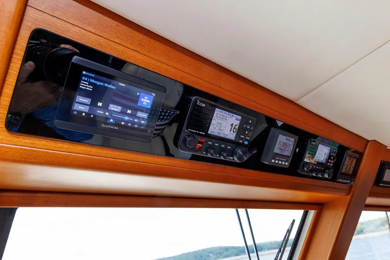 Slide: The Image of Control panel of 2007 Grand Banks 59 Aleutian RP yacht with navigation and communication systems. - 45