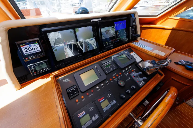 Slide: The Image of Cockpit of 2007 Grand Banks 59 Aleutian RP with advanced navigation systems and controls. - 46