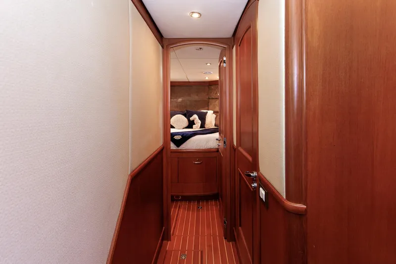 Slide: The Image of Hallway leading to a cozy bedroom on a 2007 Grand Banks 59 Aleutian RP yacht. - 52