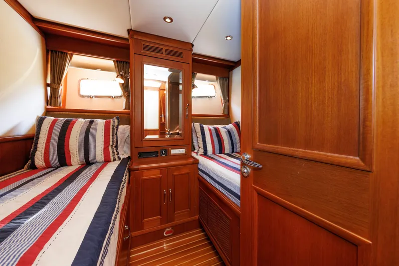 Slide: The Image of Luxurious cabin interior of 2007 Grand Banks 59 Aleutian RP yacht with twin beds. - 53