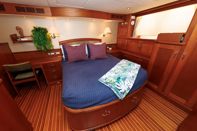 Slide: The Image of Luxurious 2007 Grand Banks 59 Aleutian RP yacht cabin with elegant wood finish and cozy bedding. - 55