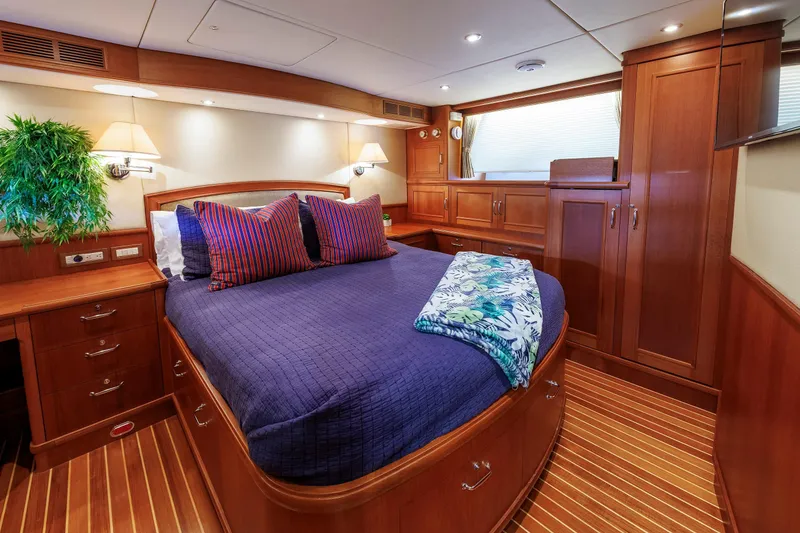Slide: The Image of Luxurious 2007 Grand Banks 59 Aleutian RP yacht cabin with elegant wood finish and cozy bedding. - 56