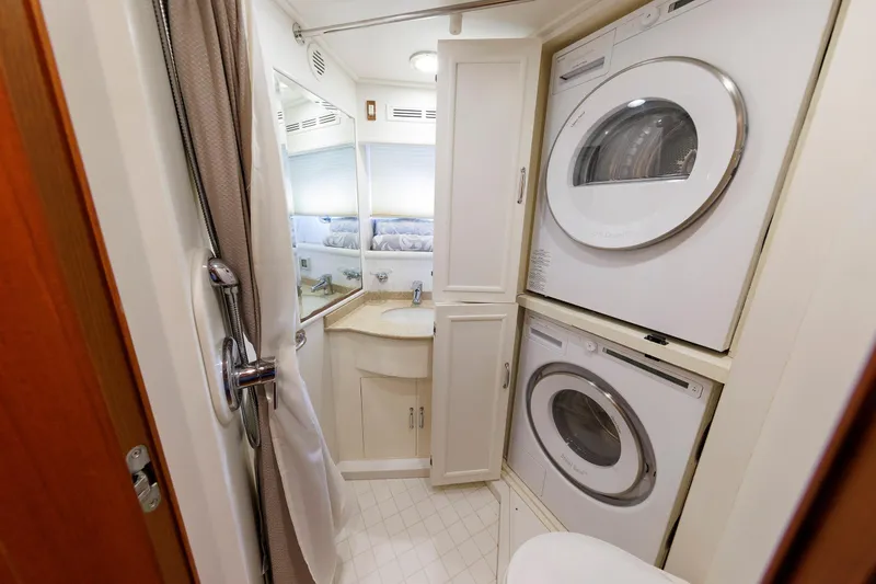 Slide: The Image of Laundry area in 2007 Grand Banks 59 Aleutian RP yacht with washer and dryer. - 62