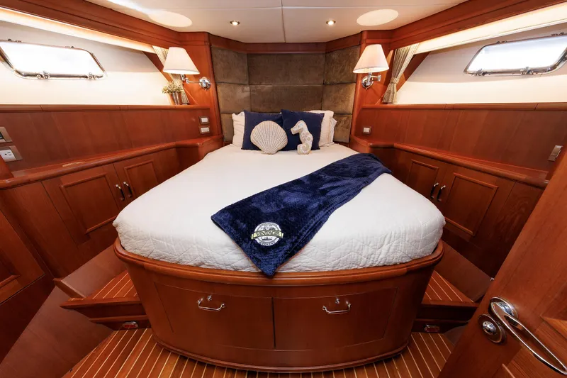 Slide: The Image of Luxurious 2007 Grand Banks 59 Aleutian RP yacht cabin with elegant wood finish. - 63