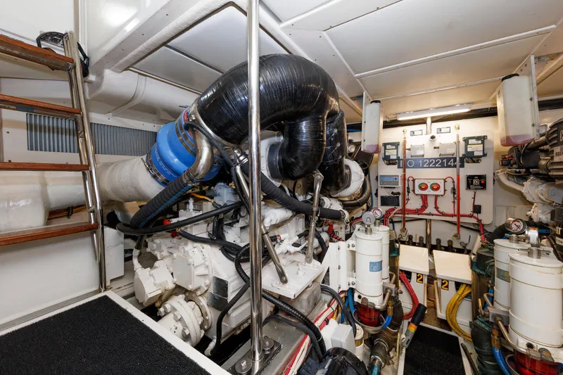 Slide: The Image of Engine room of 2007 Grand Banks 59 Aleutian RP yacht, featuring complex machinery and controls. - 68