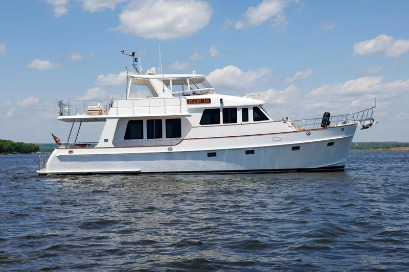 Slide: The Image of 2007 Grand Banks 59 Aleutian RP yacht cruising on a sunny day. - 7