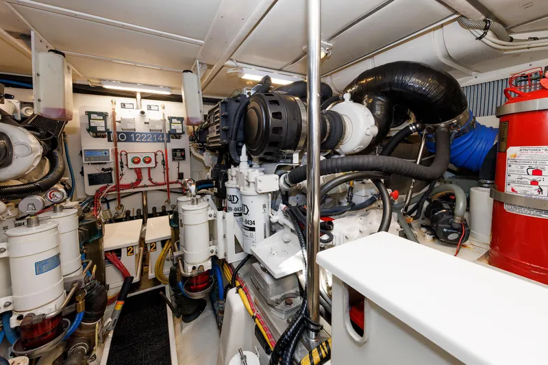 Slide: The Image of Engine room of 2007 Grand Banks 59 Aleutian RP yacht, featuring complex machinery and equipment. - 70