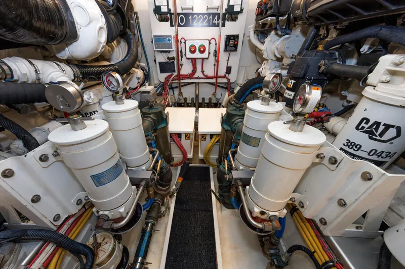 Slide: The Image of Engine room of 2007 Grand Banks 59 Aleutian RP yacht, featuring CAT machinery and gauges. - 72