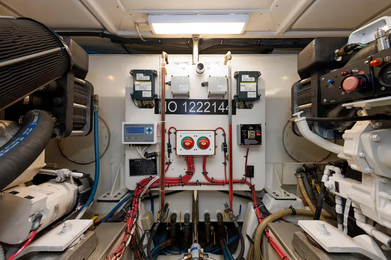 Slide: The Image of Engine room of 2007 Grand Banks 59 Aleutian RP yacht, showcasing control panels and machinery. - 73