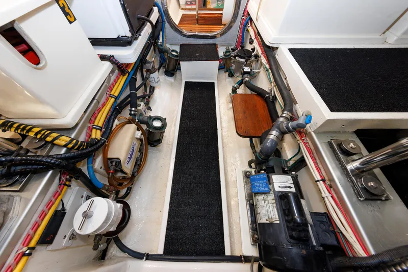 Slide: The Image of Engine room of 2007 Grand Banks 59 Aleutian RP yacht, showcasing mechanical components. - 74