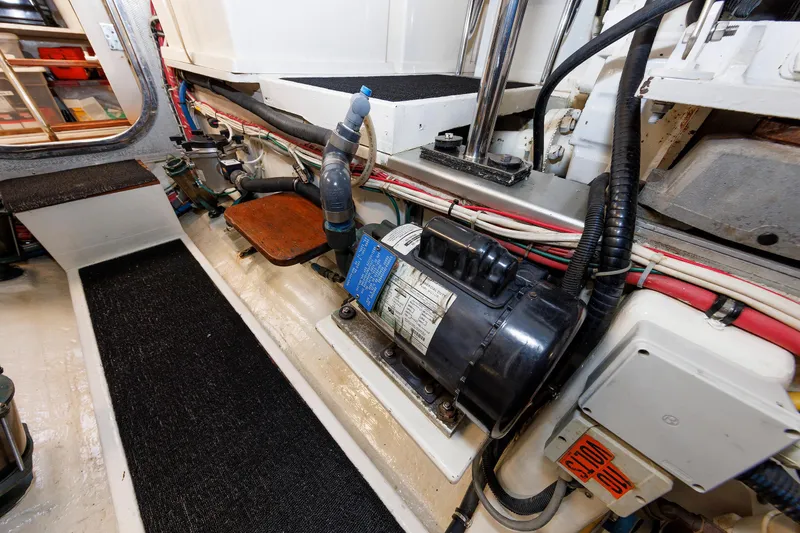 Slide: The Image of Engine room of 2007 Grand Banks 59 Aleutian RP yacht, showcasing mechanical components. - 75