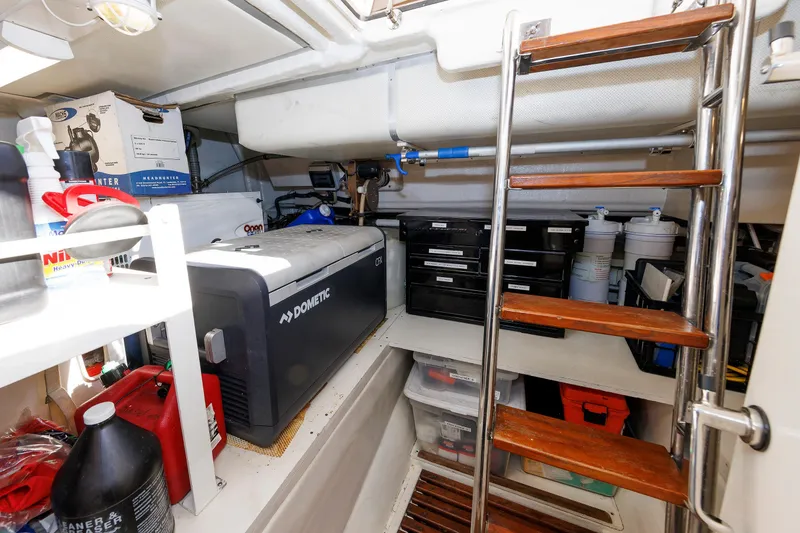 Slide: The Image of Engine room of 2007 Grand Banks 59 Aleutian RP with storage, tools, and equipment. - 80